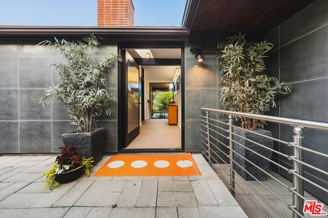 a room with table and potted plants