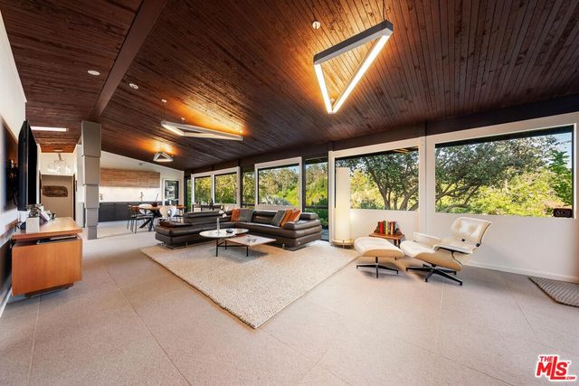 a view of a room with gym equipment and a large window