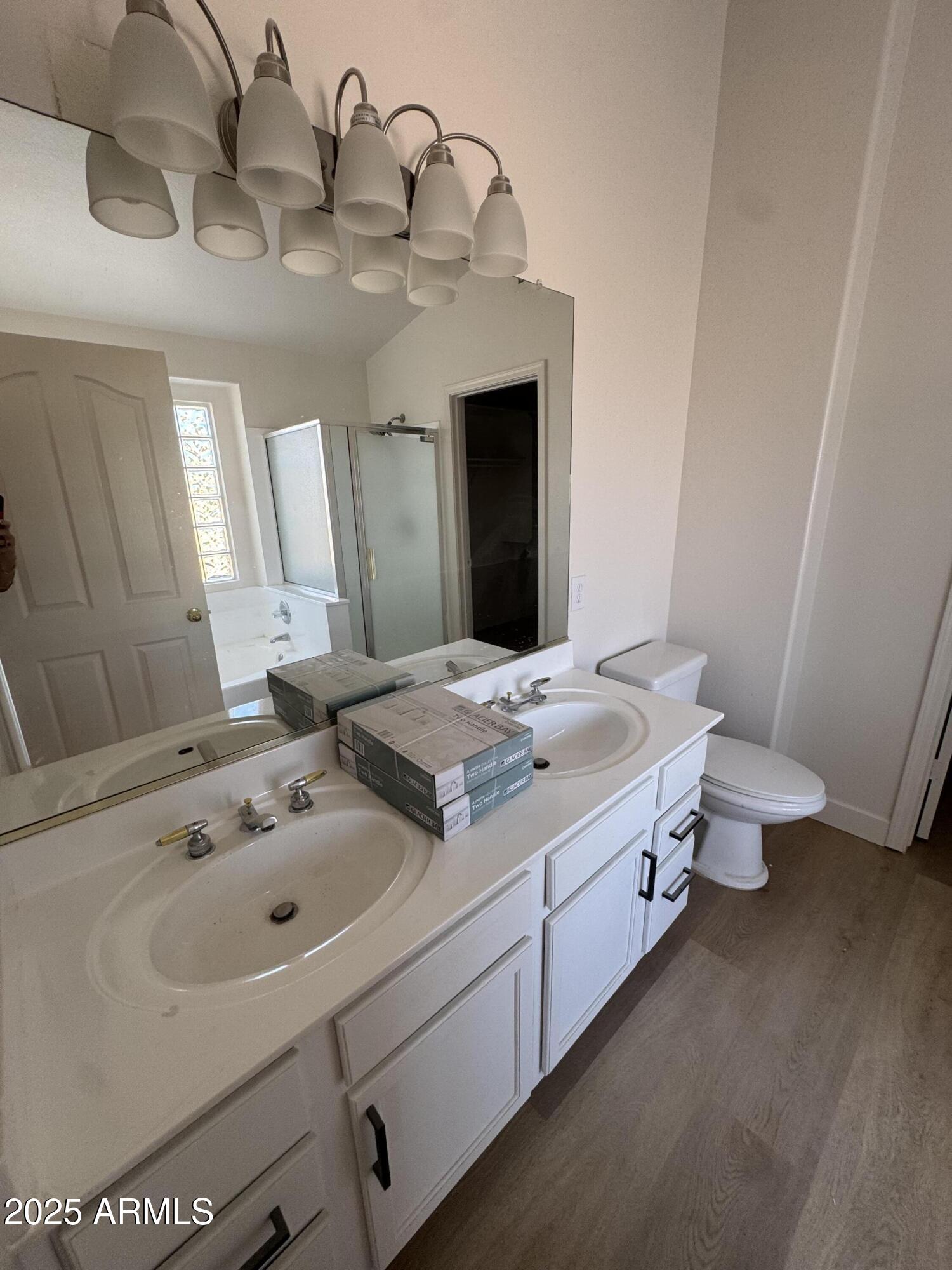 4626 East Weaver Road Phoenix, AZ 85050 - Photo 11 of 21 a bathroom with a sink and a mirror
