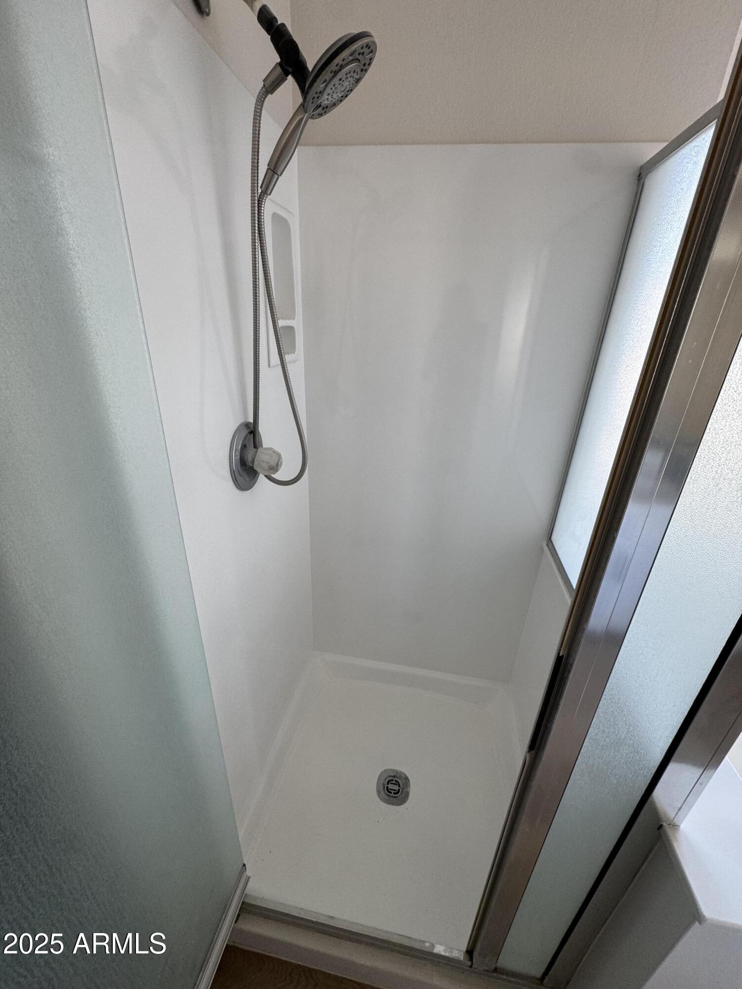 4626 East Weaver Road Phoenix, AZ 85050 - Photo 13 of 21 a bathroom with a glass shower door