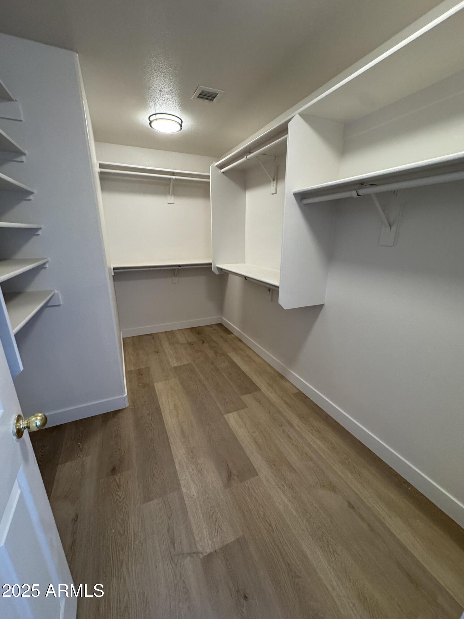 4626 East Weaver Road Phoenix, AZ 85050 - Photo 14 of 21 a view of a room with wooden floor