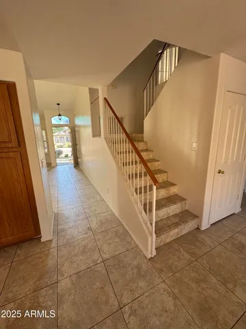 a view of a hallway with staircase