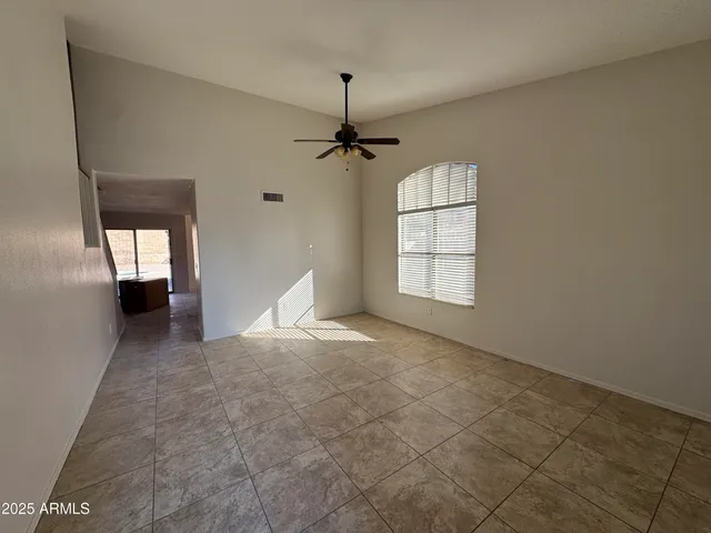 a view of empty room with windows