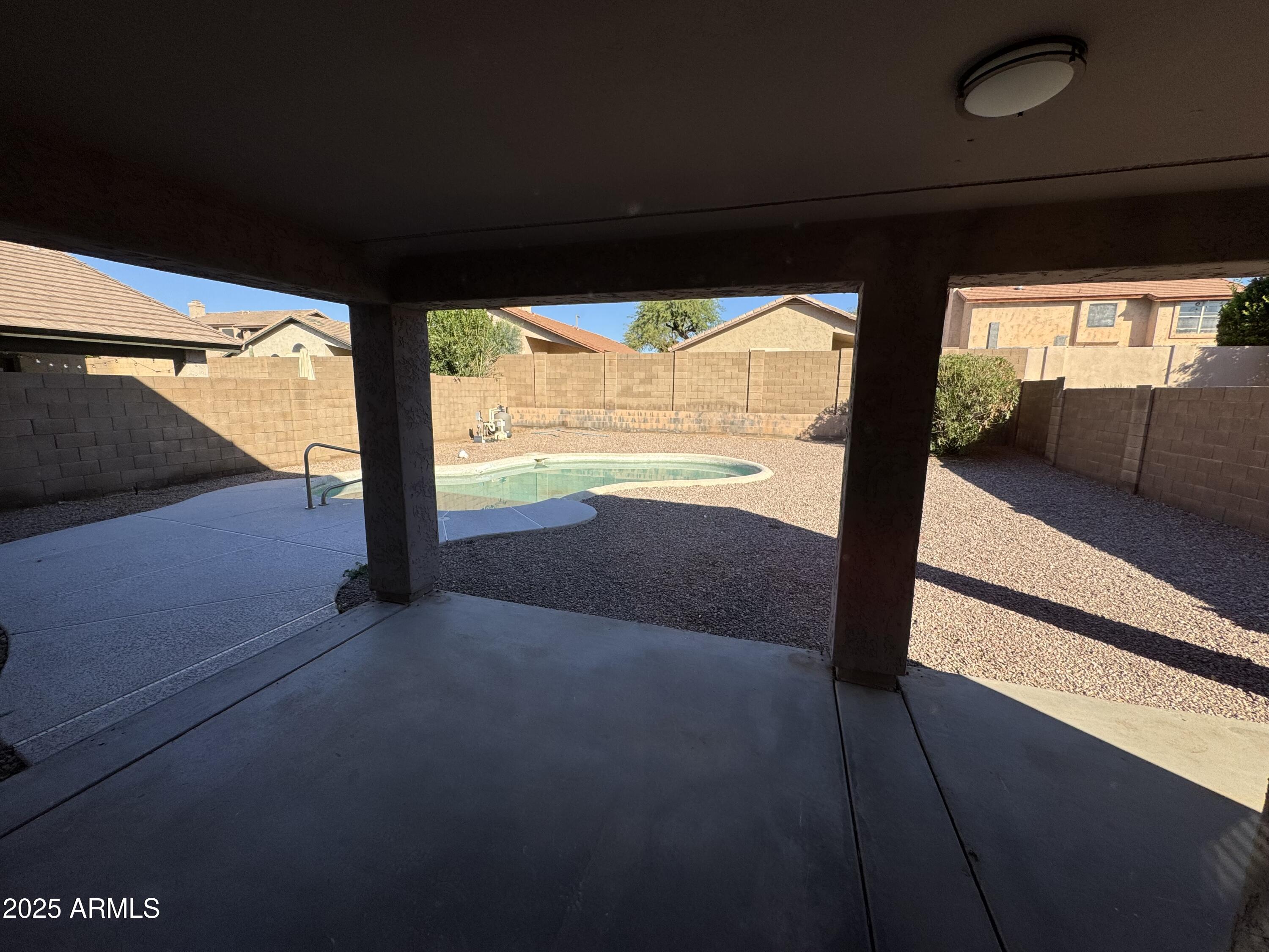 4626 East Weaver Road Phoenix, AZ 85050 - Photo 6 of 21 a view of an empty room with wooden floor and floor to ceiling window