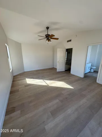 a view of a big room with carpet