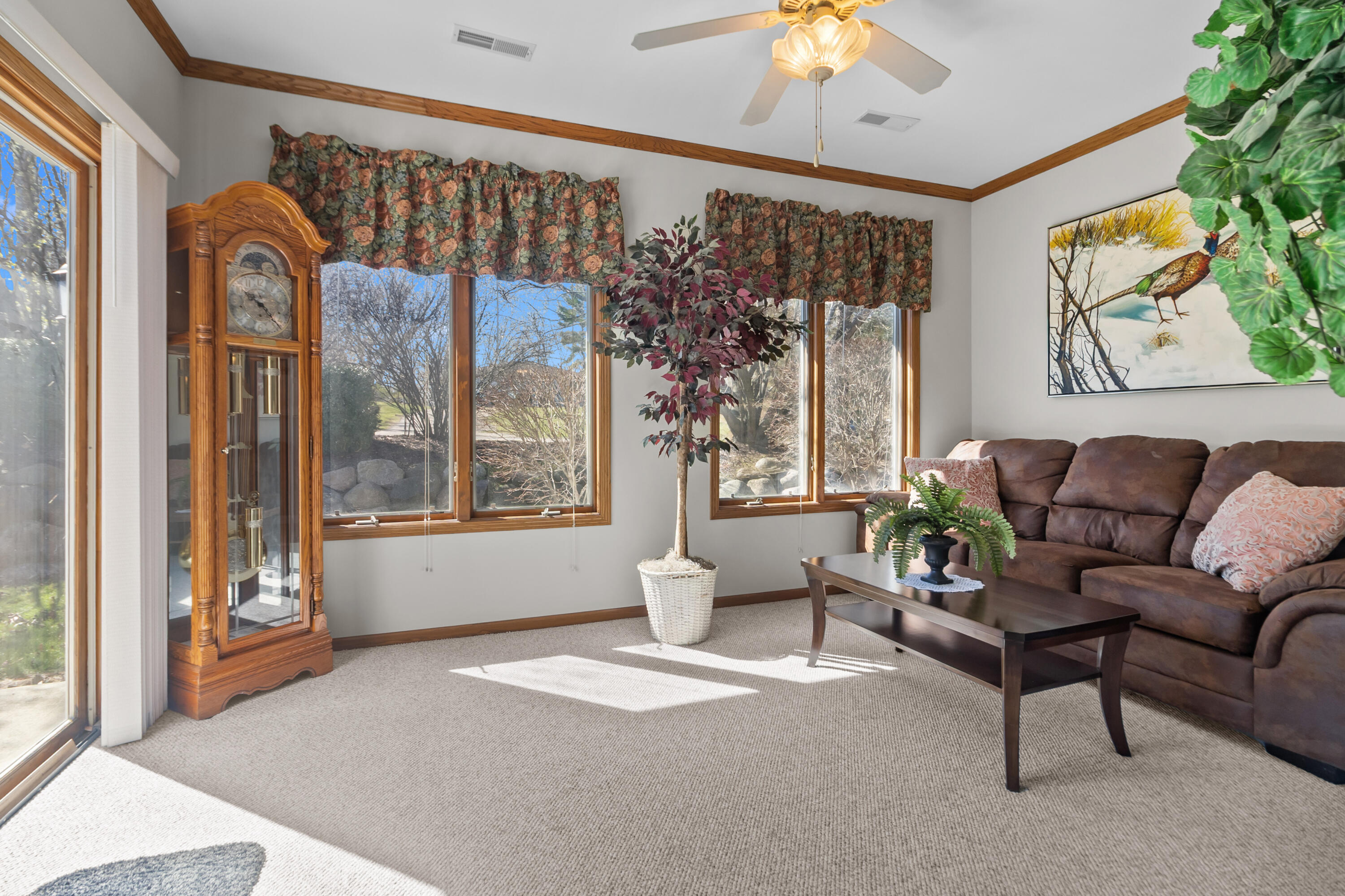 206 Potter Road, Unit 102 Elkhorn, WI 53121 - Photo 11 of 22 Bright sunroom