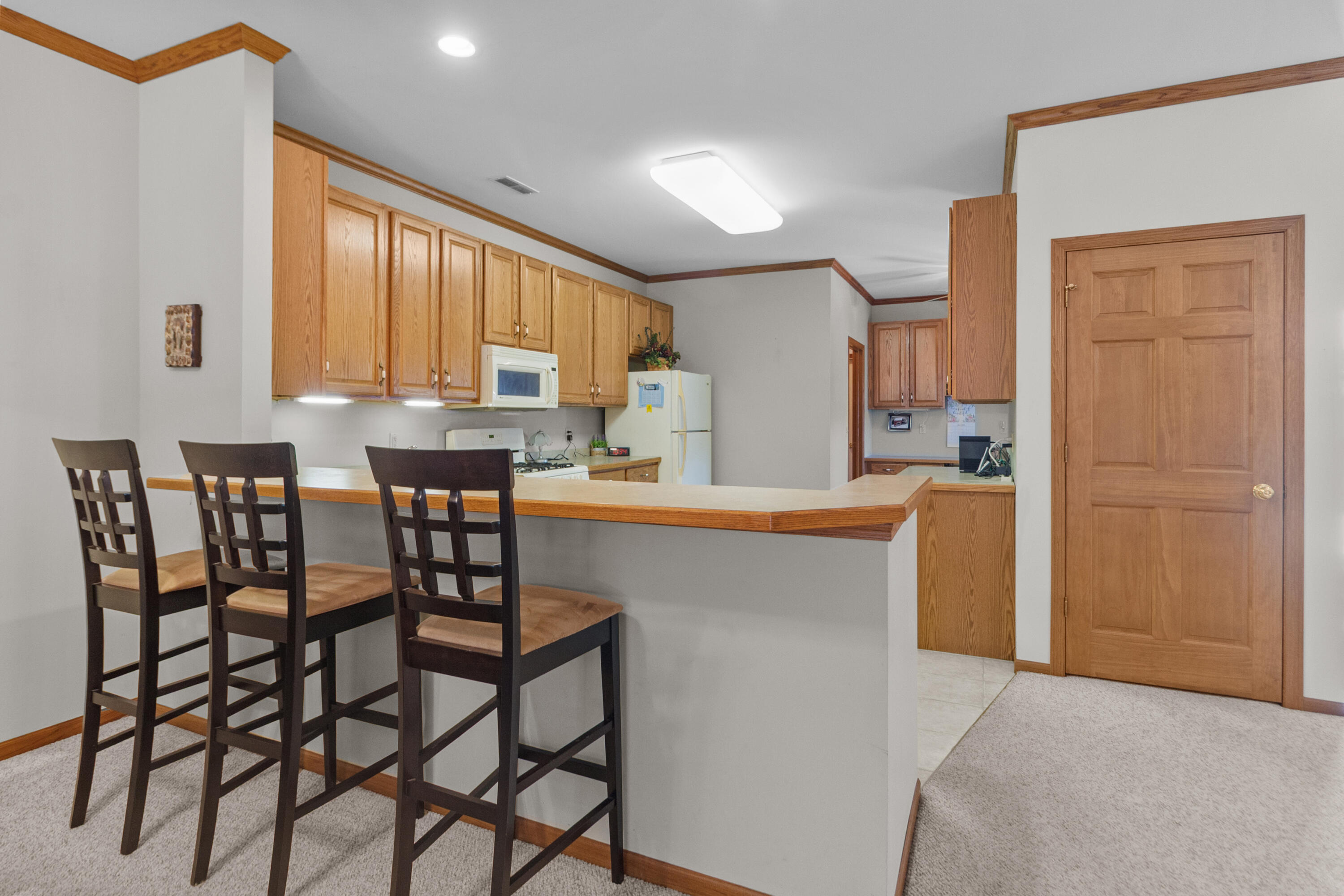 206 Potter Road, Unit 102 Elkhorn, WI 53121 - Photo 5 of 22 Extra high top seating