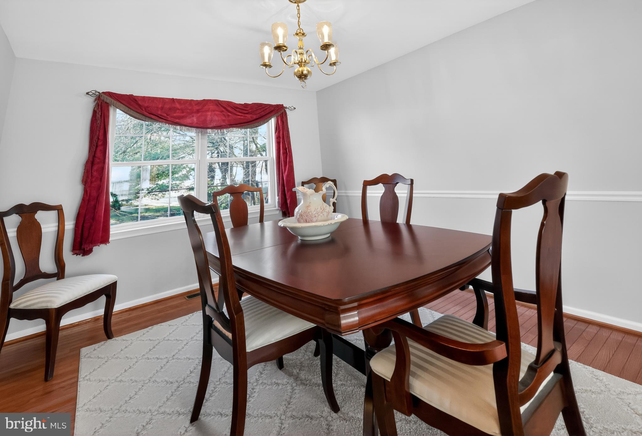 25 Country Lane Voorhees, NJ 08043 - Photo 12 of 36 a view of a dining room with furniture a chandelier and window