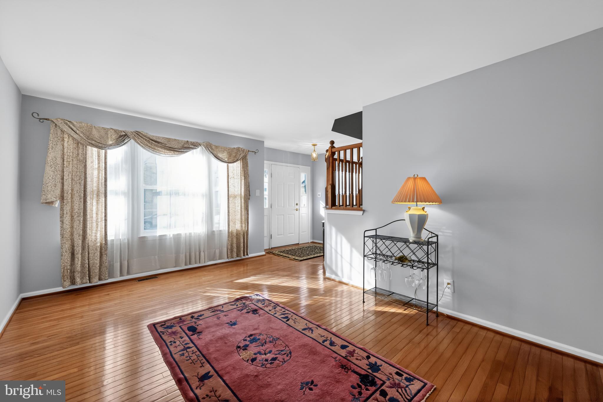 25 Country Lane Voorhees, NJ 08043 - Photo 14 of 36 a view of a livingroom with wooden floor and a cabinet