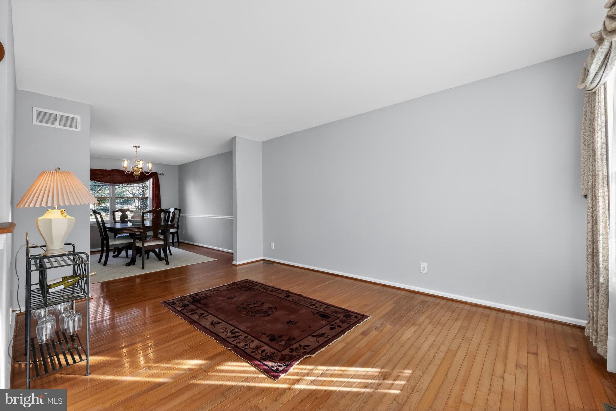 25 Country Lane Voorhees, NJ 08043 - Photo 16 of 36 a living room with furniture and a wooden floor