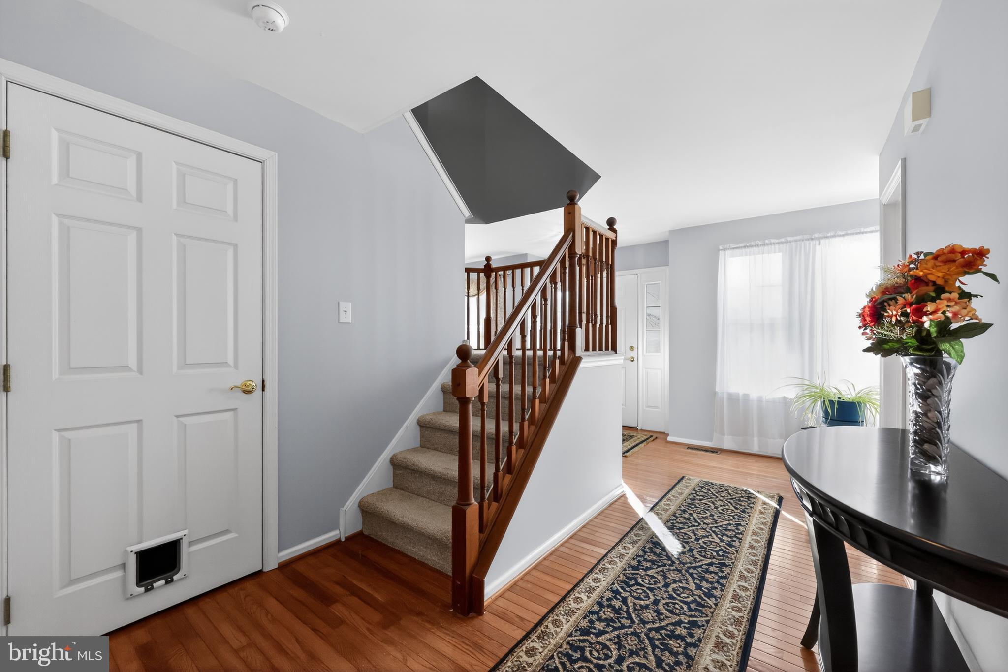 25 Country Lane Voorhees, NJ 08043 - Photo 19 of 36 a view of a hallway with furniture and wooden floor