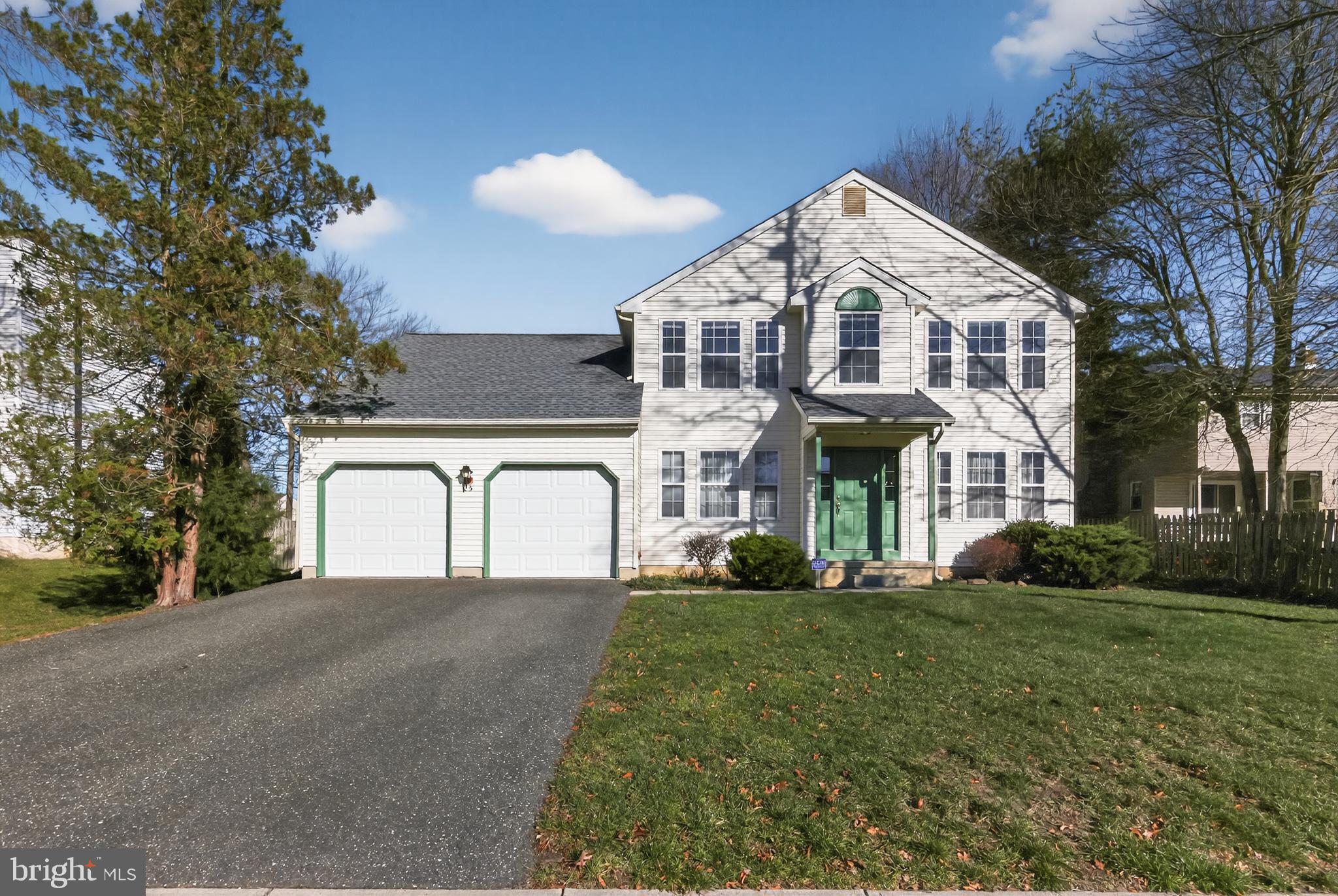 25 Country Lane Voorhees, NJ 08043 - Photo 2 of 36 a front view of a house with a garden
