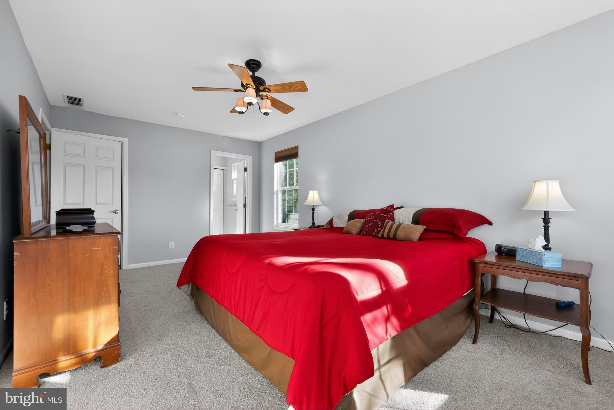 25 Country Lane Voorhees, NJ 08043 - Photo 22 of 36 a bedroom with a bed and a chandelier