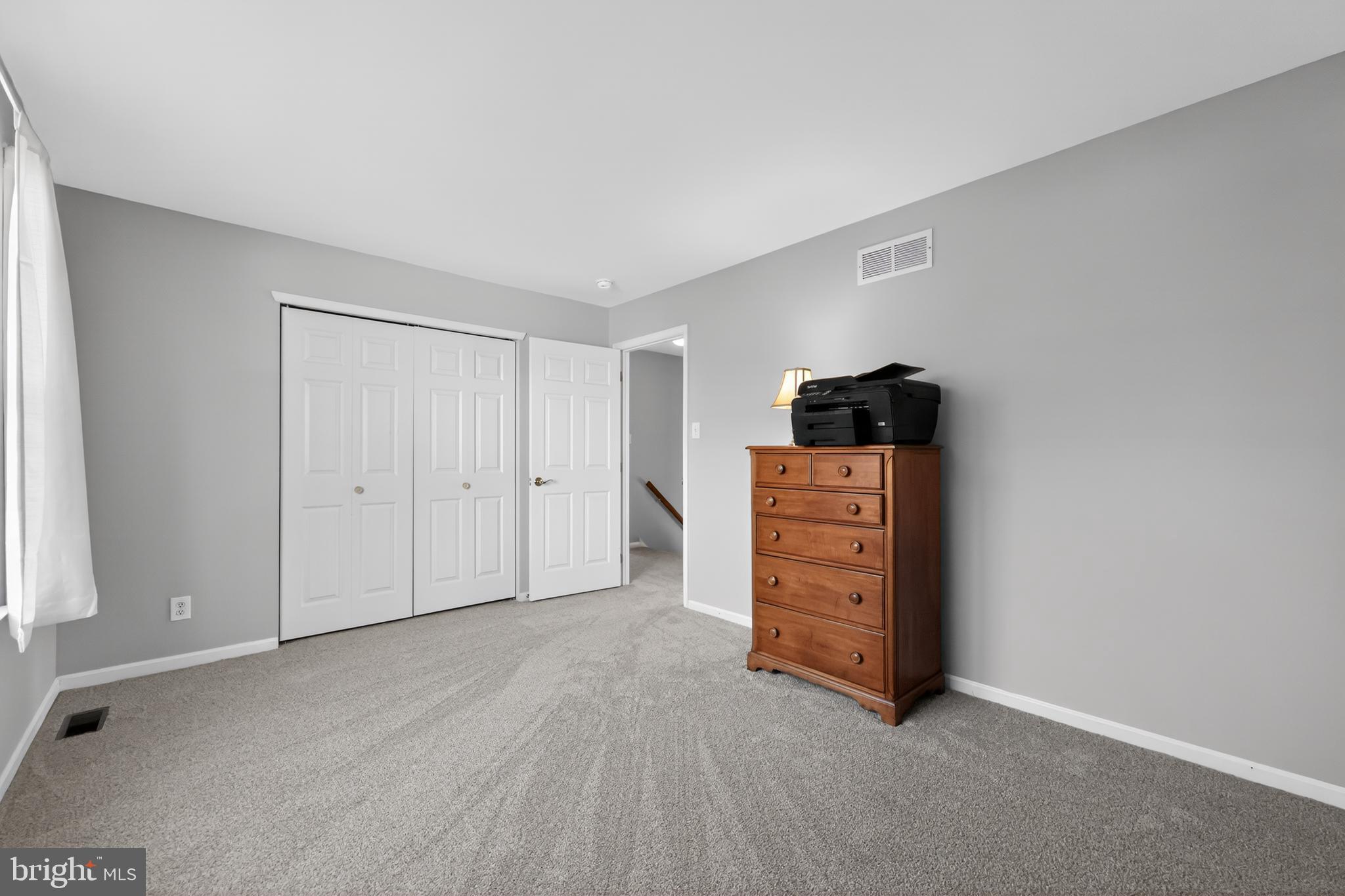 25 Country Lane Voorhees, NJ 08043 - Photo 26 of 36 a view of a livingroom with an empty space and a window
