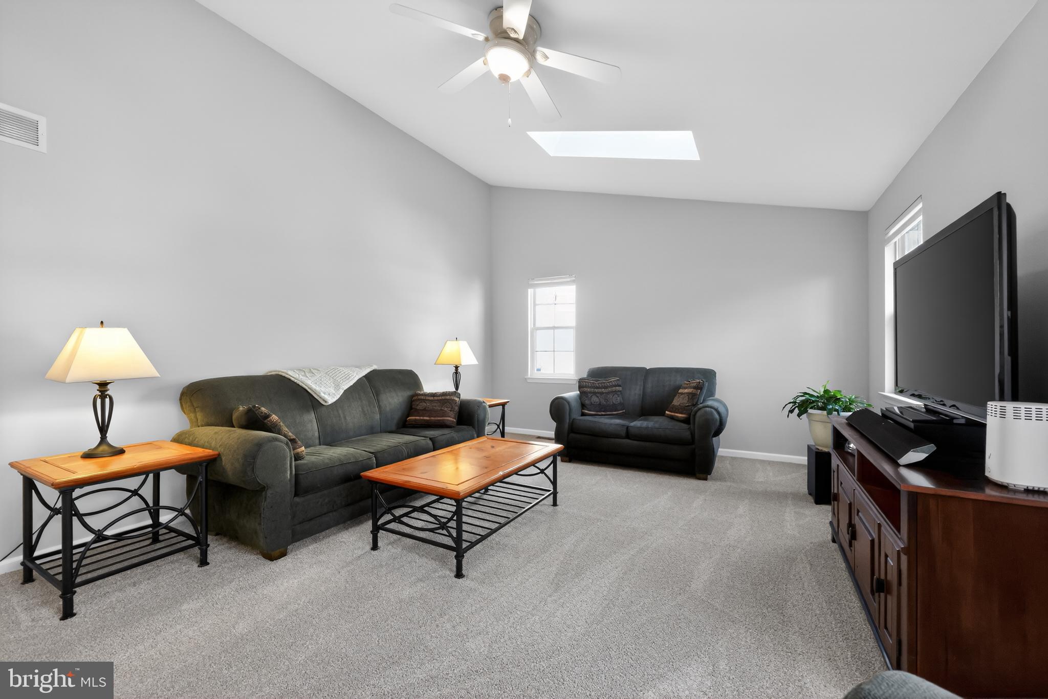 25 Country Lane Voorhees, NJ 08043 - Photo 9 of 36 a living room with furniture and a flat screen tv