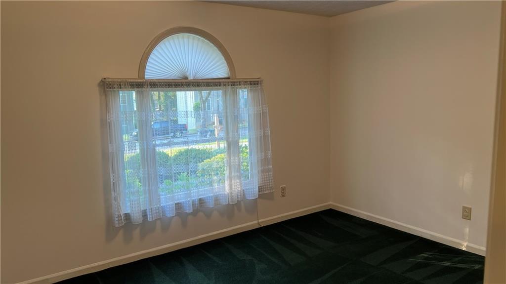 995 Old Spring Way Northeast Sugar Hill, GA 30518 - Photo 15 of 36 a view of empty room with wooden floor and fan