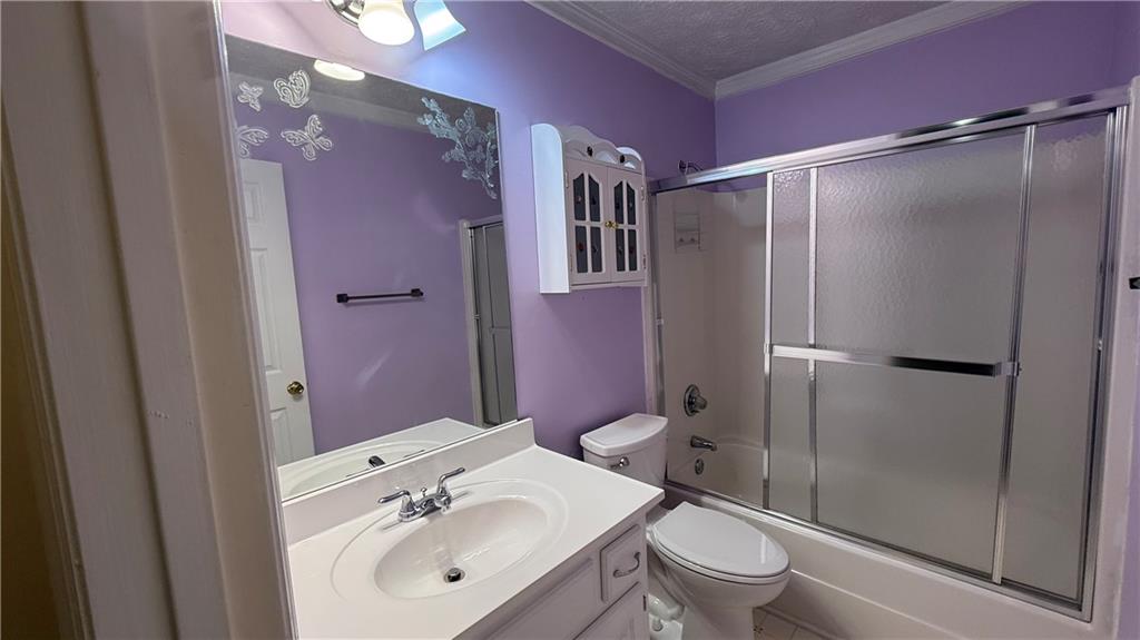 995 Old Spring Way Northeast Sugar Hill, GA 30518 - Photo 17 of 36 a bathroom with a sink toilet and shower