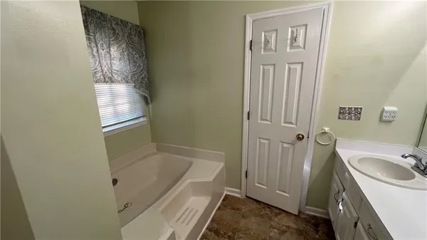 a bathroom with a sink and a tub