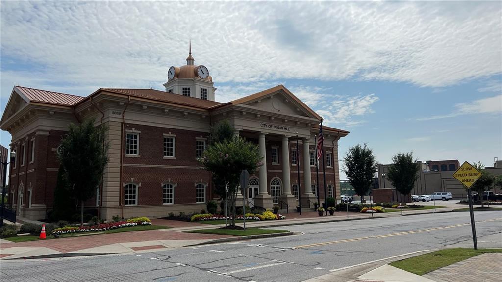 995 Old Spring Way Northeast Sugar Hill, GA 30518 - Photo 32 of 36 a front view of a house with street