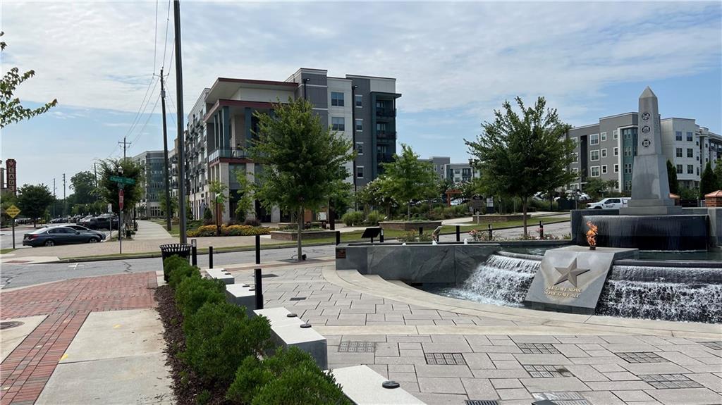 995 Old Spring Way Northeast Sugar Hill, GA 30518 - Photo 34 of 36 a view of a patio with couches and potted plants