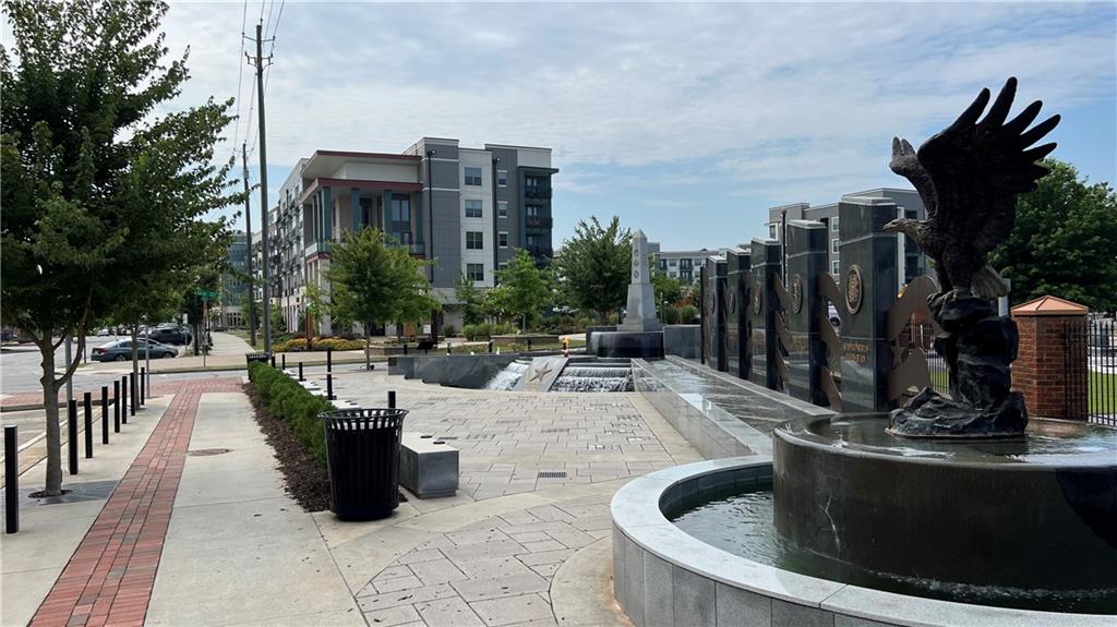995 Old Spring Way Northeast Sugar Hill, GA 30518 - Photo 35 of 36 a view of swimming pool with outdoor seating and plants