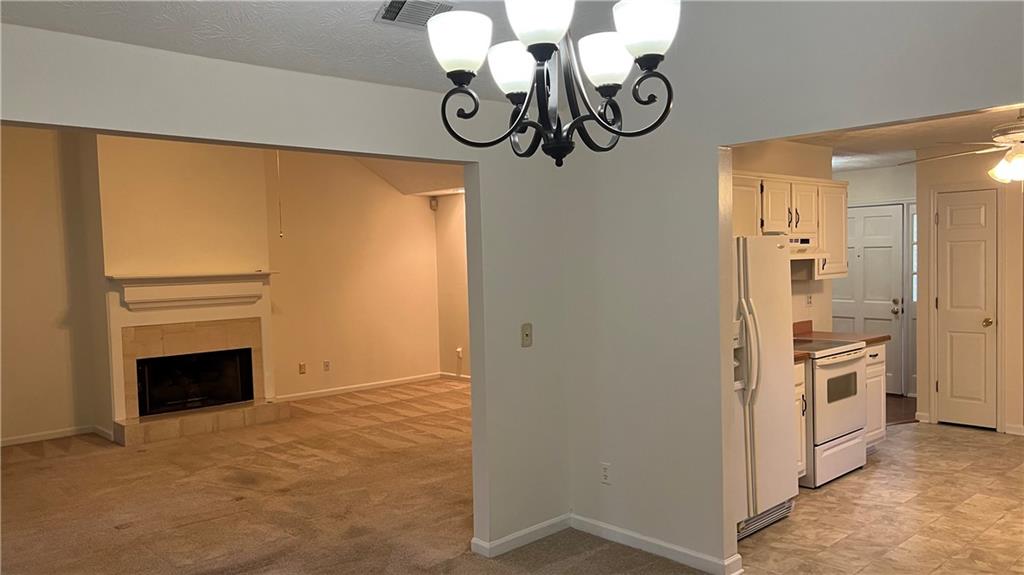 995 Old Spring Way Northeast Sugar Hill, GA 30518 - Photo 7 of 36 a view of a livingroom with a chandelier