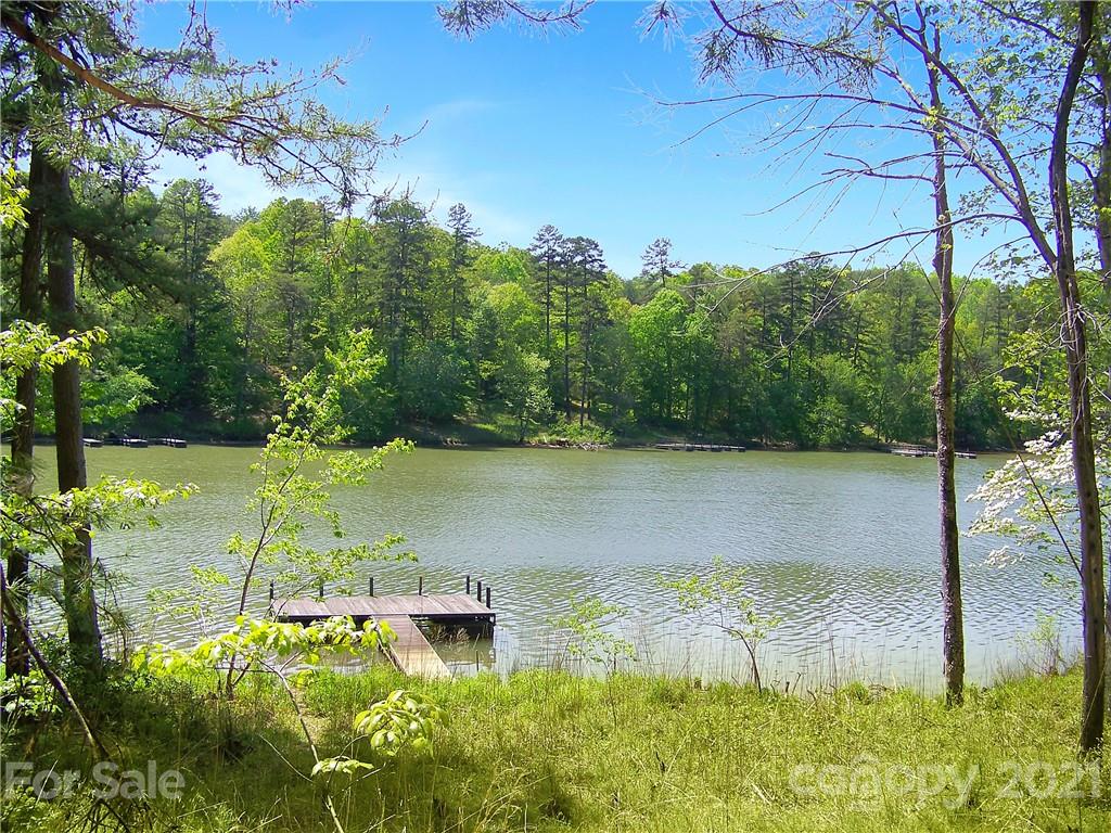 8 Parkway North Rd Mill Spring, Unit 8 Mill Spring, NC 28756 - Photo 10 of 16 a view of a lake with a yard