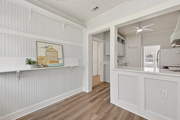 a view of a kitchen cabinets and wooden floor