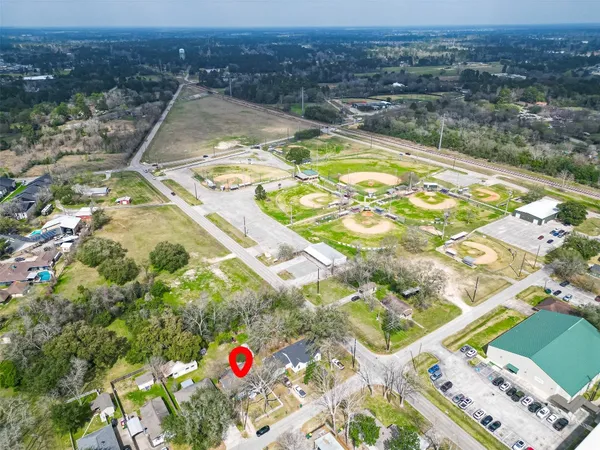 an aerial view of residential houses with outdoor space
