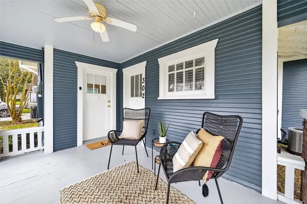 a view of a livingroom with furniture and a ceiling fan