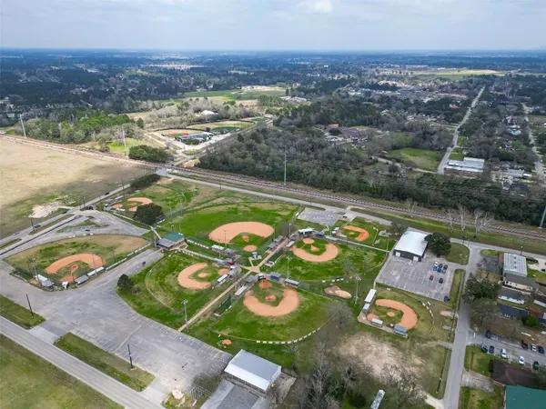 an aerial view of residential houses with outdoor space