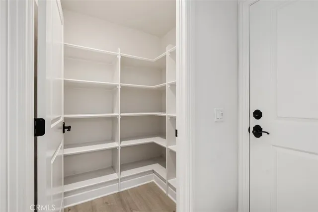 a spacious bathroom with a double vanity sink a mirror and a bathtub