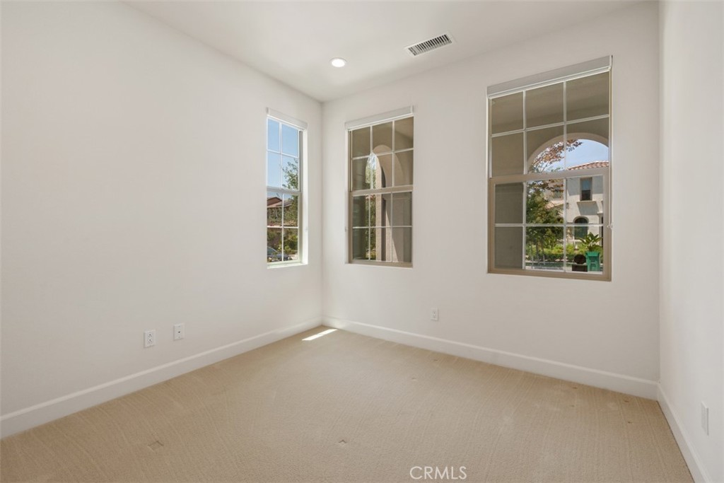 116 Windswept Irvine, CA 92618 - Photo 19 of 74 an empty room with windows