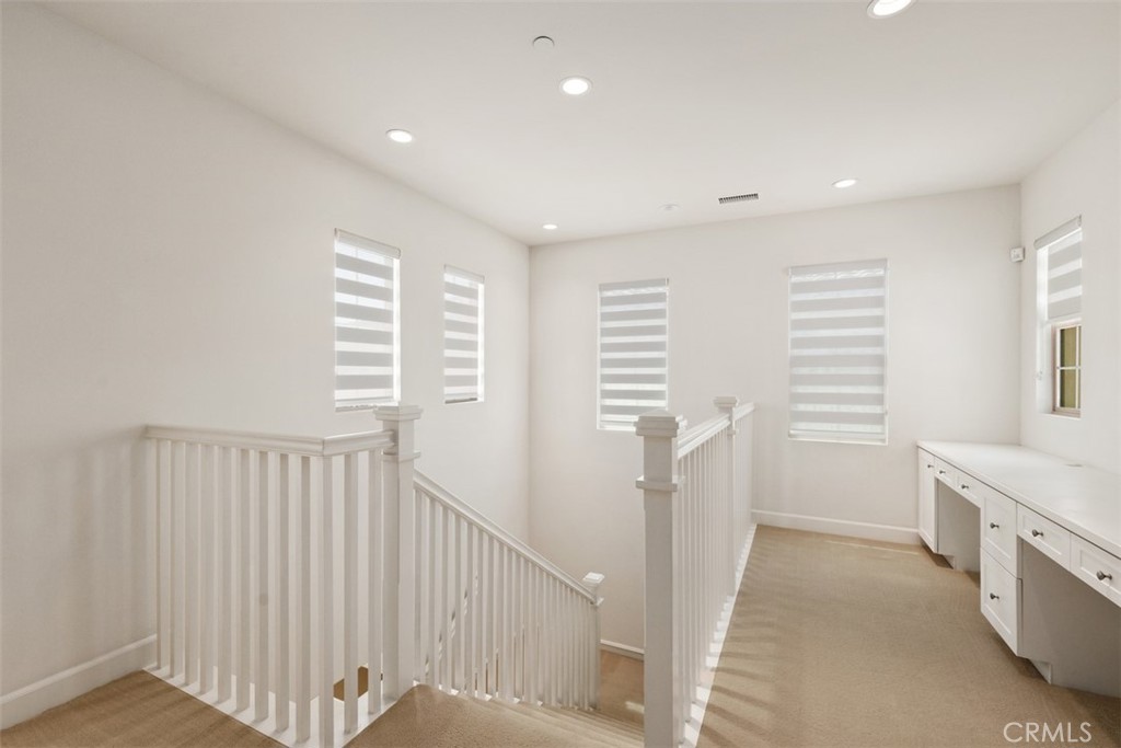 116 Windswept Irvine, CA 92618 - Photo 22 of 74 a view of hallway with stairs and a window