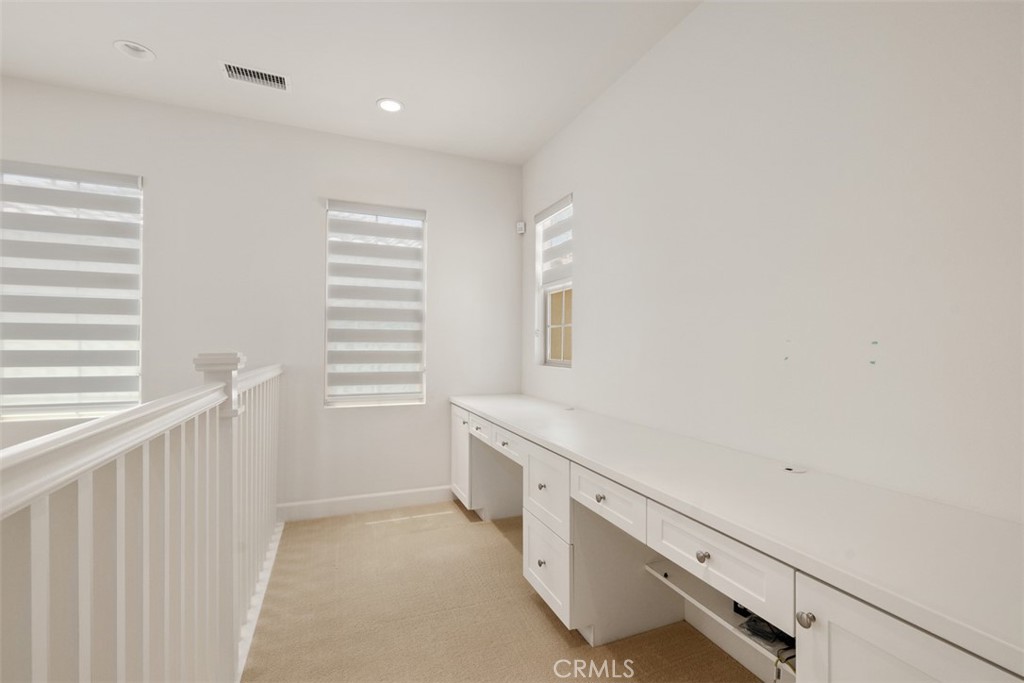 116 Windswept Irvine, CA 92618 - Photo 23 of 74 a bathroom with a double vanity sink and a window