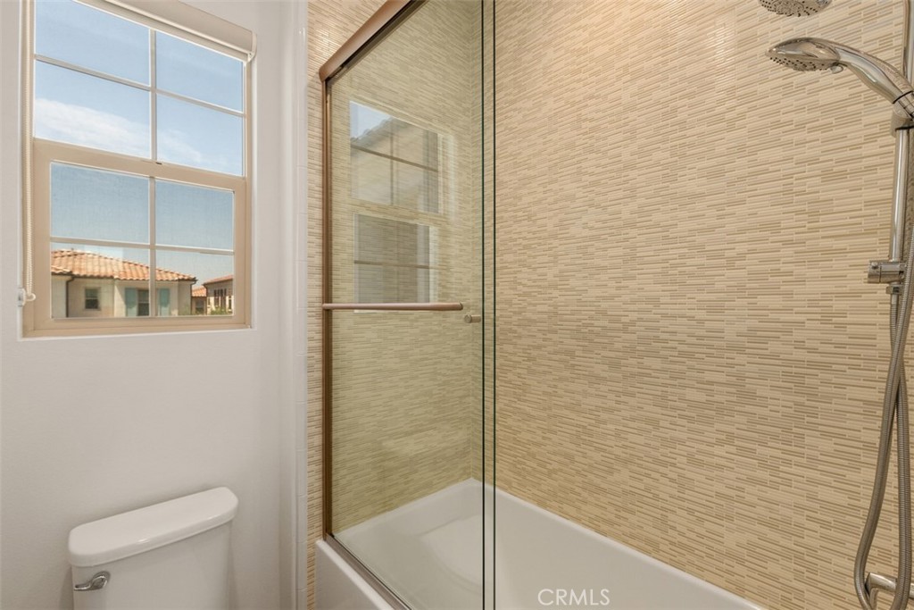 116 Windswept Irvine, CA 92618 - Photo 33 of 74 a bathroom with a toilet and a shower