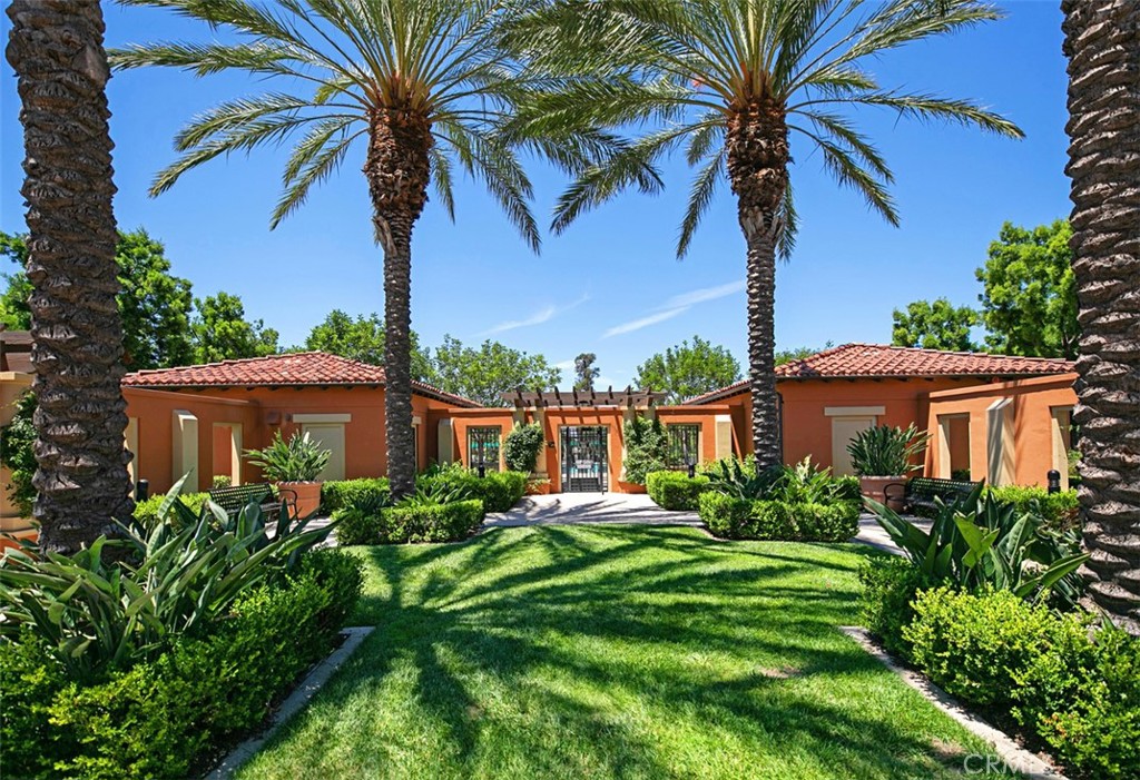 116 Windswept Irvine, CA 92618 - Photo 45 of 74 a view of a house with a yard and potted plants