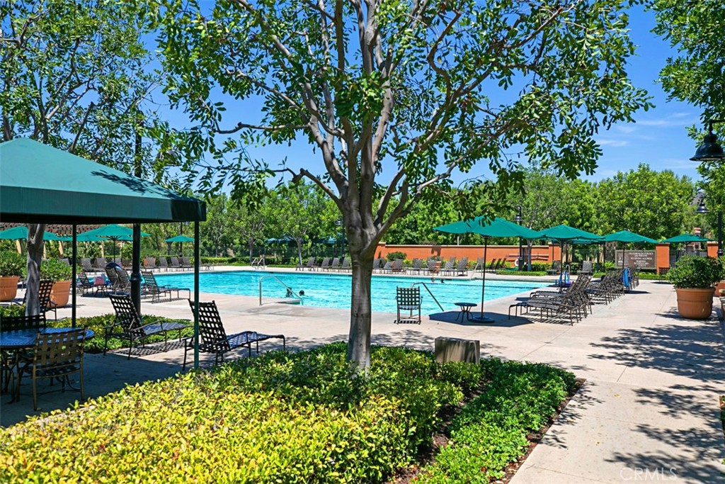 116 Windswept Irvine, CA 92618 - Photo 46 of 74 a view of a street with a bench and trees