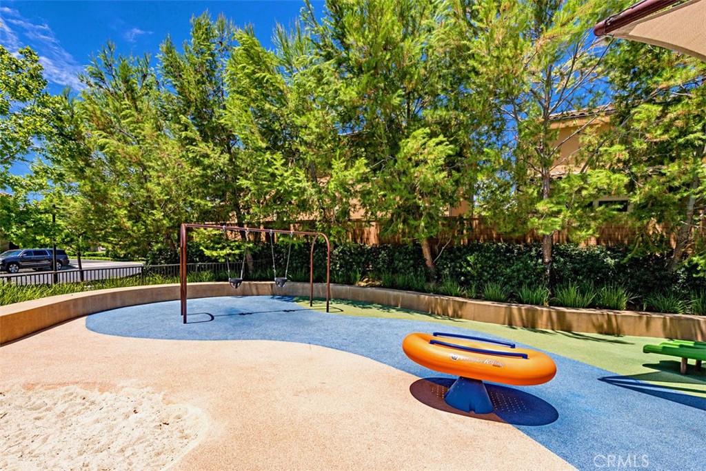 116 Windswept Irvine, CA 92618 - Photo 50 of 74 a swimming pool with an outdoor space and seating area