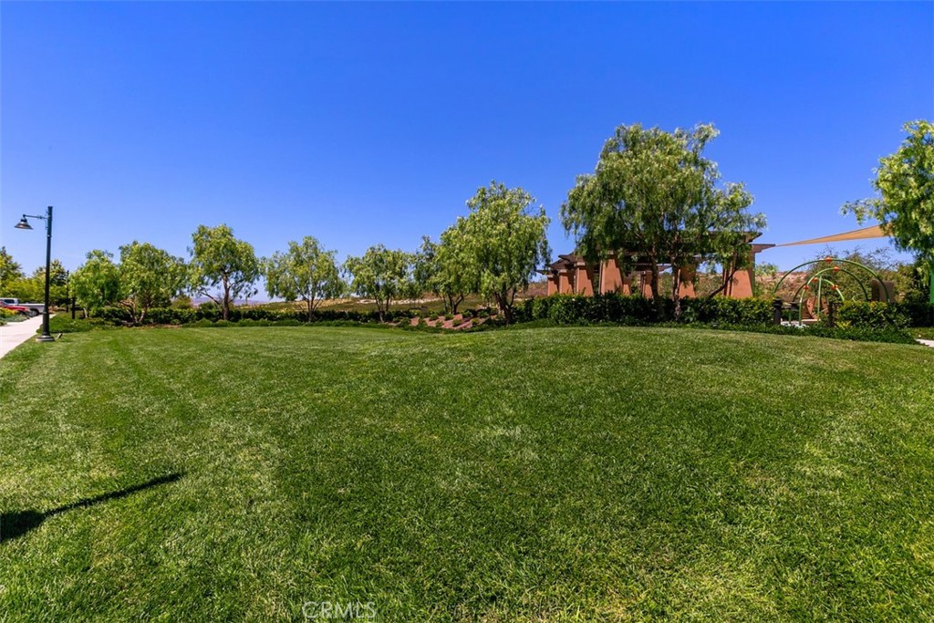 116 Windswept Irvine, CA 92618 - Photo 64 of 74 a view of a field of grass and trees