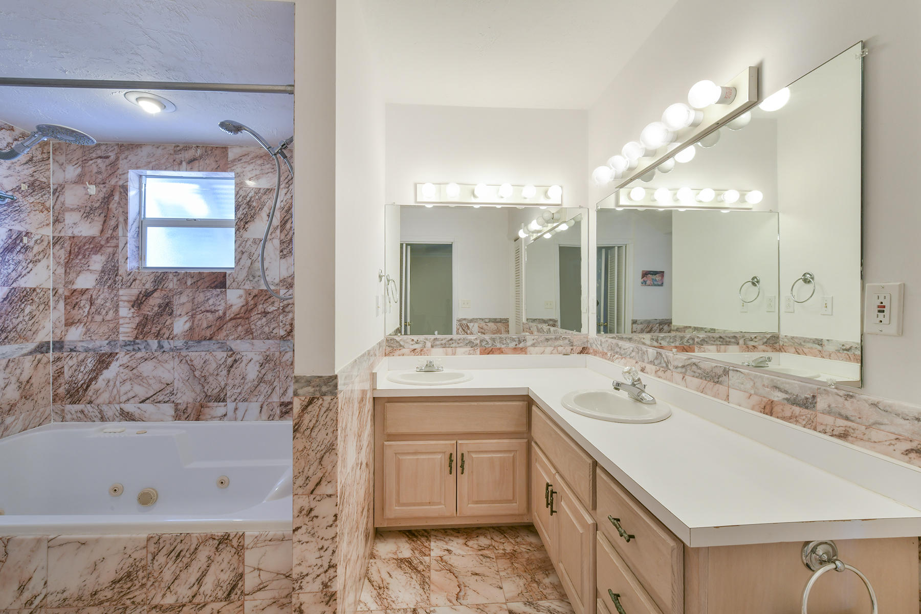 186 Harborview Drive Tavernier, FL 33070 - Photo 25 of 32 a spacious bathroom with a bathtub sink and mirror