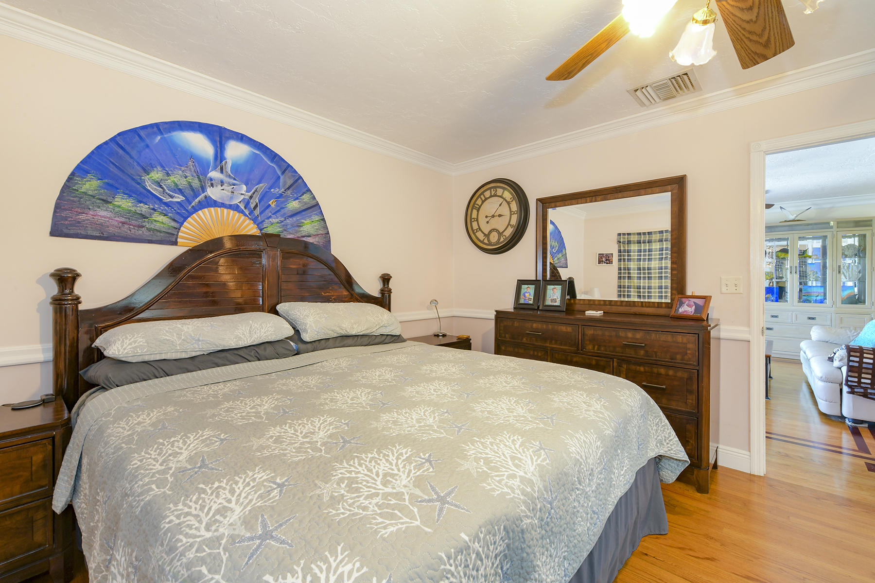 186 Harborview Drive Tavernier, FL 33070 - Photo 26 of 32 a bedroom with a bed and a chandelier