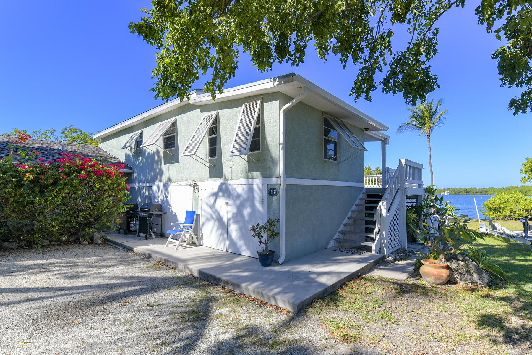 186 Harborview Drive Tavernier, FL 33070 - Photo 8 of 32 a view of a house with a yard