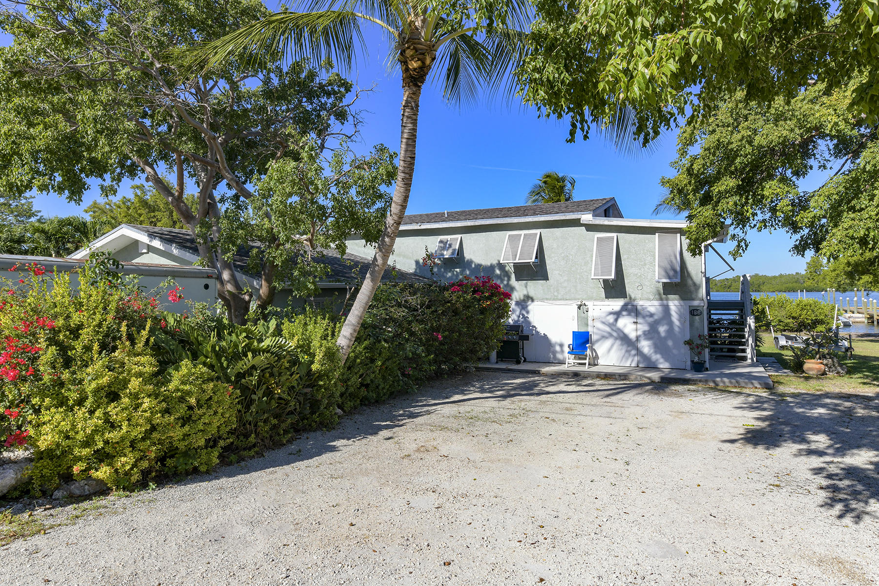 186 Harborview Drive Tavernier, FL 33070 - Photo 9 of 32 a view of a house with a flower garden