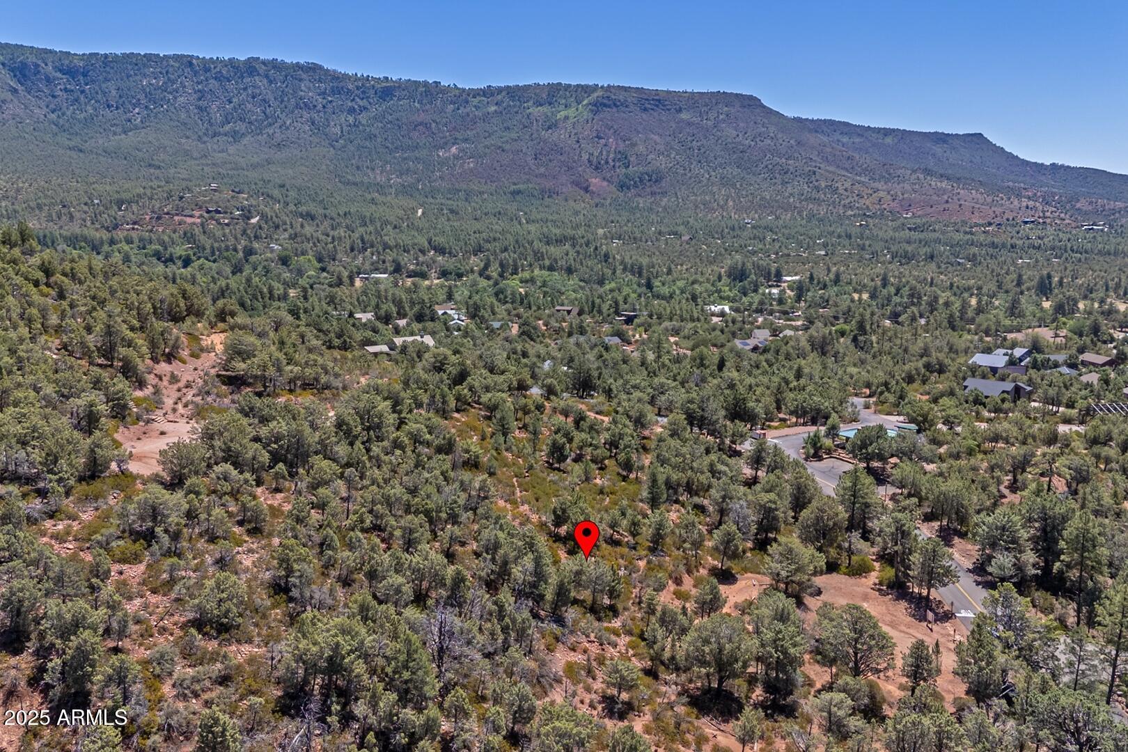 Tract D West Ruin Hill Loop, Unit 165 Pine, AZ 85544 - Photo 18 of 20 a view of a lush green hillside and a building