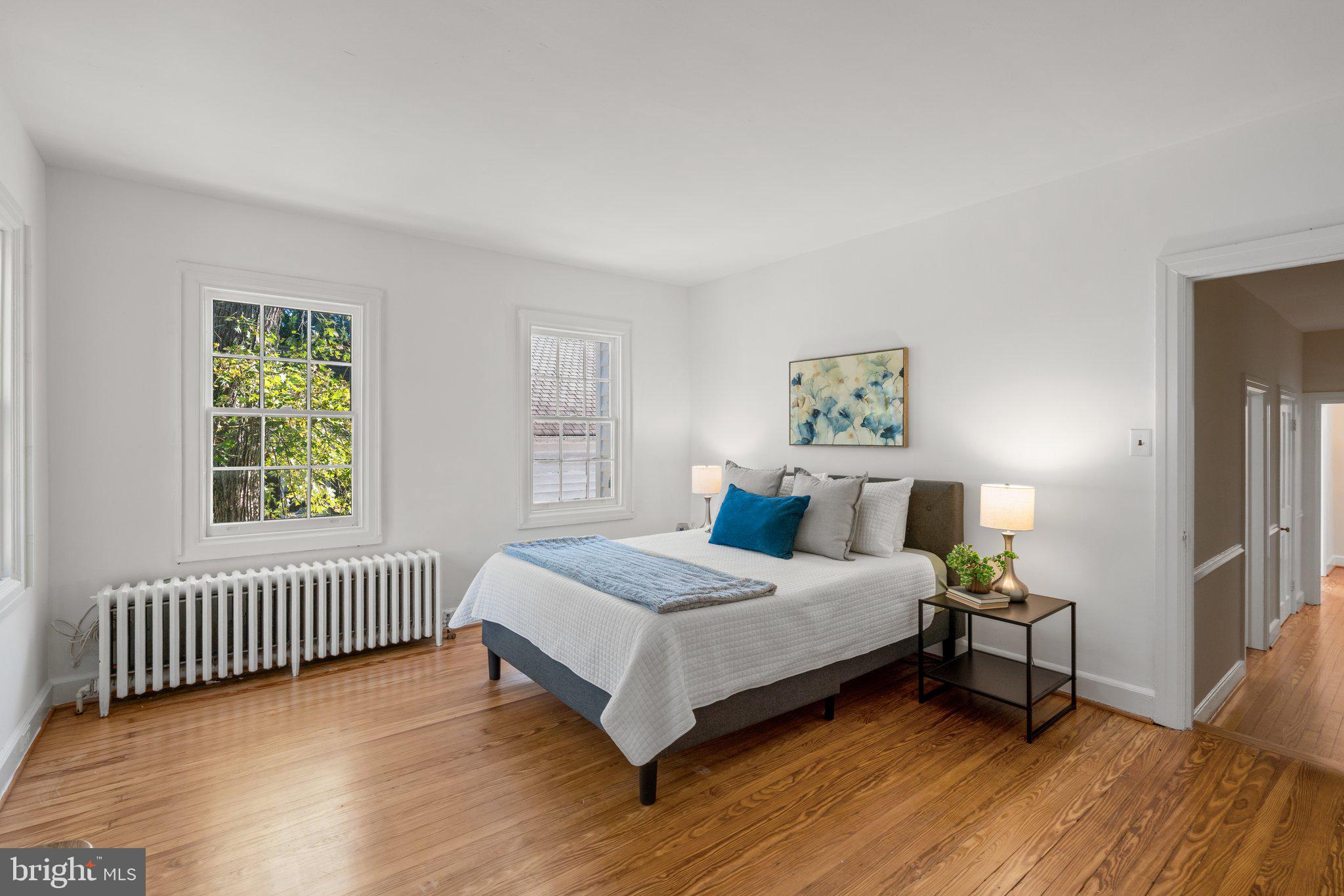 2505 Pickwick Road Baltimore, MD 21207 - Photo 20 of 48 Large primary bedroom with lovely hardwood floors