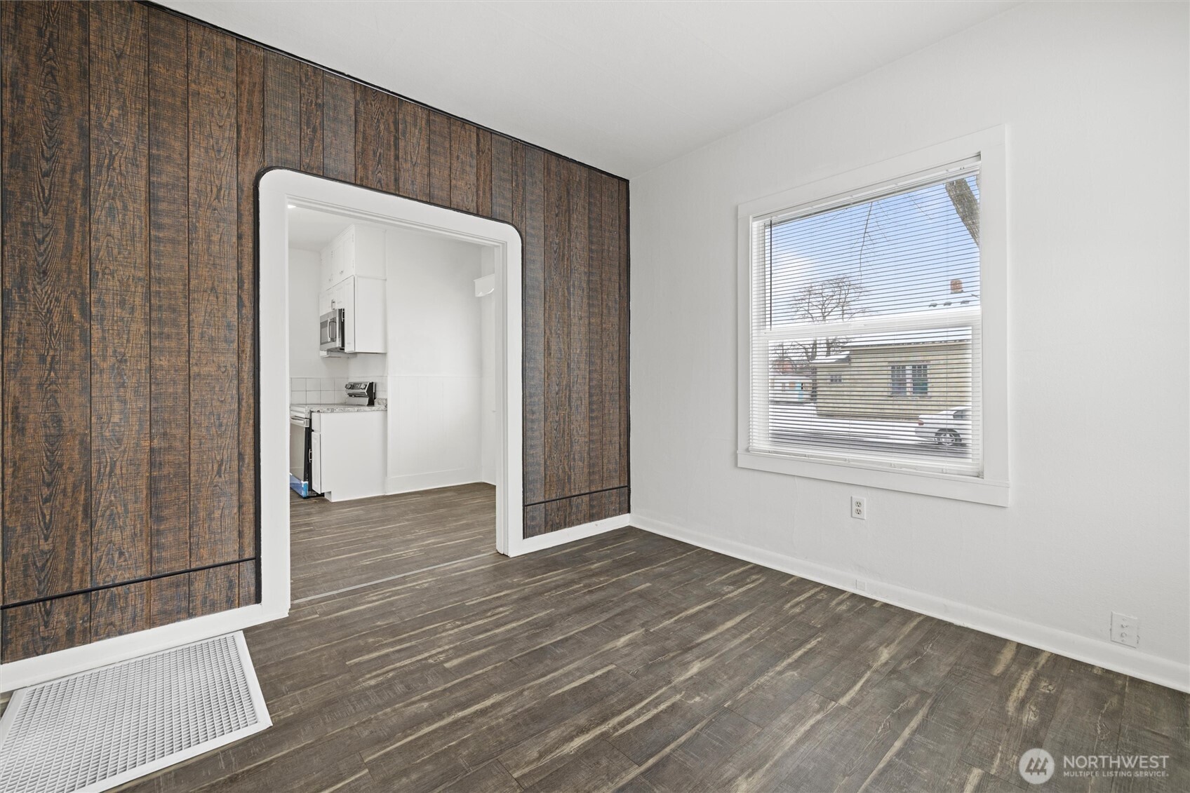 902 Emma Street Walla Walla, WA 99362 - Photo 14 of 29 a view of an empty room with wooden floor and a bathroom