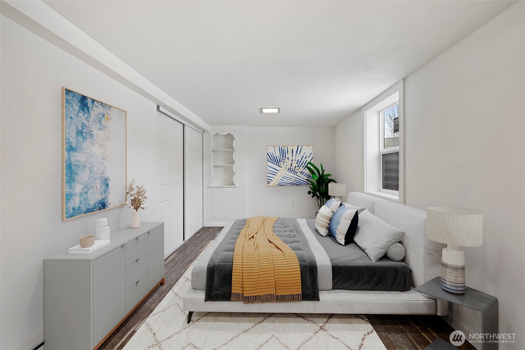 902 Emma Street Walla Walla, WA 99362 - Photo 15 of 29 a spacious bedroom with a bed and a couch