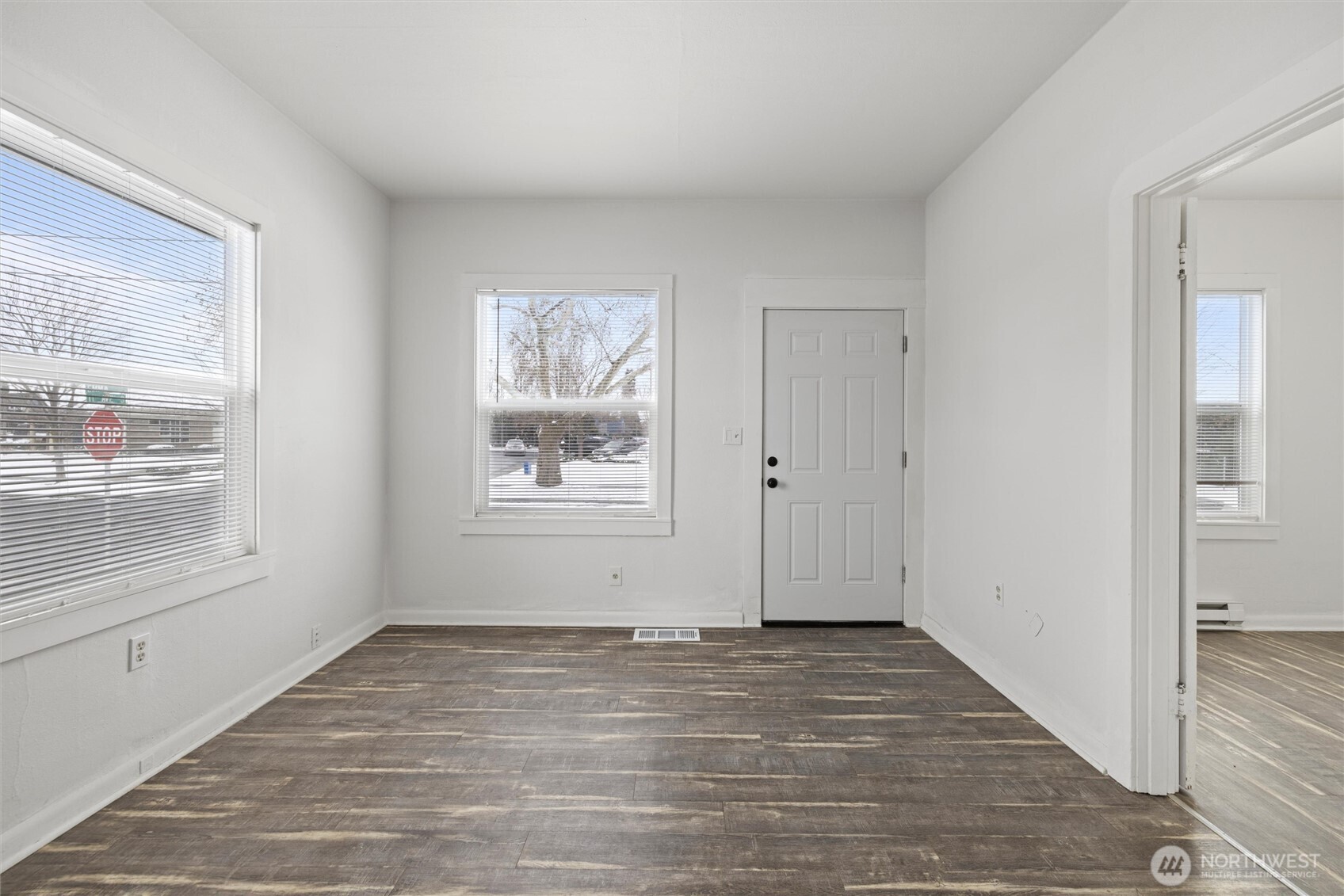 902 Emma Street Walla Walla, WA 99362 - Photo 5 of 29 a view of an empty room with wooden floor and a window