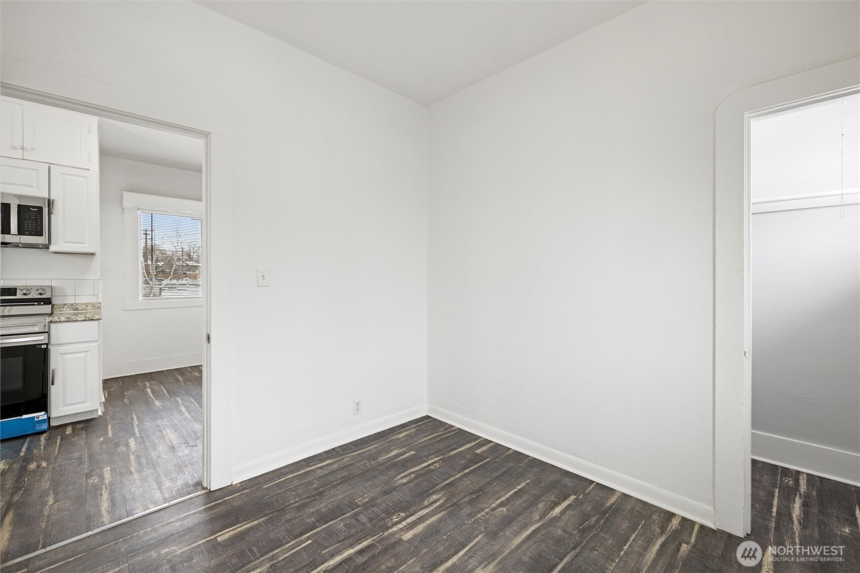 902 Emma Street Walla Walla, WA 99362 - Photo 10 of 29 a view of a kitchen with wooden floor and a sink
